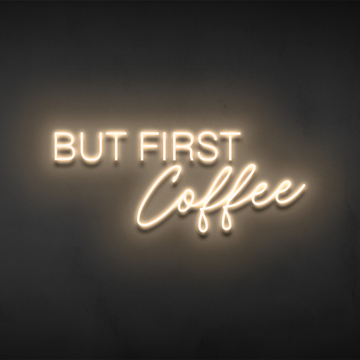 But First Coffee sign in warm-white block and script neon