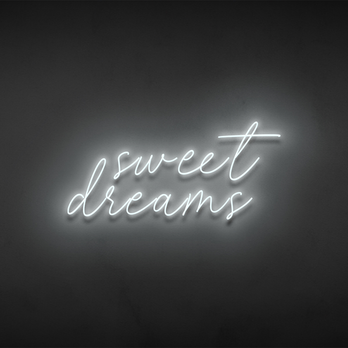 Sweet Dreams sign rendered in neon on a dark wall